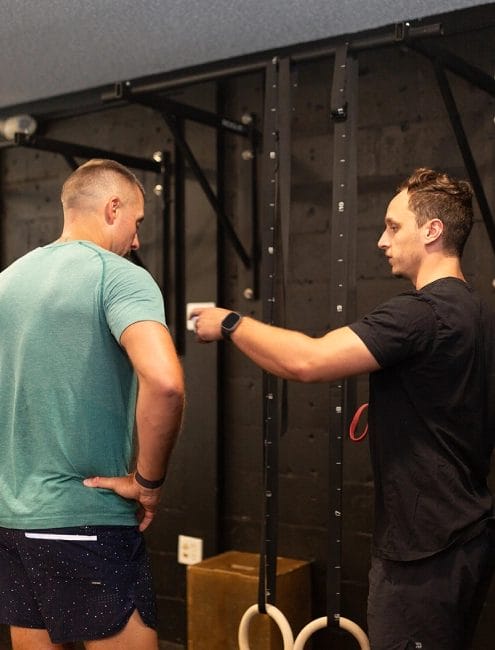 Man and coach at Maverick Strength